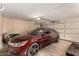 A spacious garage featuring an automatic door and ample space for parking and storage at 10713 N 36Th Ave, Phoenix, AZ 85029