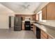 Bright kitchen featuring stainless steel appliances and light wood cabinets at 10713 N 36Th Ave, Phoenix, AZ 85029