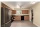Bright kitchen featuring stainless steel appliances and light wood cabinets at 10713 N 36Th Ave, Phoenix, AZ 85029