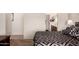 A bedroom leading to a bathroom, showing a glimpse of the sink and toilet at 10960 E Monte Ave # 131, Mesa, AZ 85209
