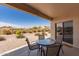 Covered patio area, perfect for relaxation with views of the well-maintained backyard at 10960 E Monte Ave # 131, Mesa, AZ 85209