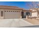 Inviting single-story home with a two-car garage, covered entry and cozy front porch seating at 10960 E Monte Ave # 131, Mesa, AZ 85209