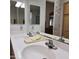 Bathroom featuring a double sink vanity with a white countertop, wood cabinets, and a mirror at 11411 N 91St Ave # 175, Peoria, AZ 85345