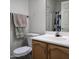 Cozy bathroom featuring a toilet, vanity with wood cabinets, and towel rack at 11411 N 91St Ave # 175, Peoria, AZ 85345