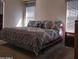 Bedroom featuring a king-size bed with patterned bedding and bright natural light at 11411 N 91St Ave # 175, Peoria, AZ 85345