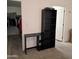 Bedroom featuring black desk and bookshelf next to closet with shelf and hanging storage at 11411 N 91St Ave # 175, Peoria, AZ 85345