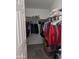 Organized closet with clothes on hangers and storage shelves offering practical storage solutions at 11411 N 91St Ave # 175, Peoria, AZ 85345