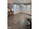 Inviting dining area featuring stylish light fixture and ample natural light from multiple windows at 11411 N 91St Ave # 175, Peoria, AZ 85345