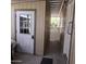 Covered walkway with an entry door with glass to let light in, and a lattice fence to the rear at 11411 N 91St Ave # 175, Peoria, AZ 85345