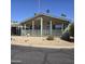 Inviting single-story home featuring a covered front porch and desert landscaping at 11411 N 91St Ave # 175, Peoria, AZ 85345
