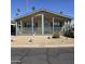 Attractive single-story home showcasing a covered front porch and low maintenance desert landscaping at 11411 N 91St Ave # 175, Peoria, AZ 85345