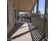 Spacious front porch with room for seating, protected by a railing and covered roof at 11411 N 91St Ave # 175, Peoria, AZ 85345