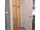 Hallway storage with built-in cabinets and a view of the bedroom through an open doorway at 11411 N 91St Ave # 175, Peoria, AZ 85345