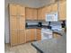 Bright kitchen features wooden cabinets and drawers, complete with countertop appliances at 11411 N 91St Ave # 175, Peoria, AZ 85345