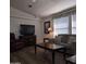 Comfortable living room featuring wood laminate flooring, neutral tones, and ample natural light at 11411 N 91St Ave # 175, Peoria, AZ 85345