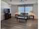 Cozy living room with modern flooring, comfortable seating, and abundant natural light at 11411 N 91St Ave # 175, Peoria, AZ 85345