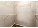 A walk-in closet offering storage with built-in wire shelving and wood-look flooring at 14250 W Wigwam Blvd # 812, Litchfield Park, AZ 85340