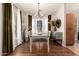 Chic dining area bathed in natural light with stylish curtains, a chandelier, and a dining set at 14250 W Wigwam Blvd # 812, Litchfield Park, AZ 85340