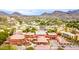 Expansive aerial view of a community with lush greenery, landscaping, and architecture nestled amongst Arizona mountains at 1717 E Morten Ave # 7, Phoenix, AZ 85020