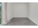 An empty bedroom with sleek tiled floors and a large window at 1717 E Morten Ave # 7, Phoenix, AZ 85020