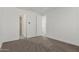 Bright and airy bedroom featuring neutral carpet and doorways to other rooms at 1717 E Morten Ave # 7, Phoenix, AZ 85020