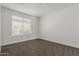 Minimalist bedroom design with neutral carpet, window with blinds, and bright natural light at 1717 E Morten Ave # 7, Phoenix, AZ 85020