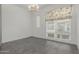 Bright dining room featuring stylish light fixture and large window with floral valance at 1717 E Morten Ave # 7, Phoenix, AZ 85020