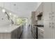Open kitchen with modern cabinets, stainless appliances, and a large island with bar seating at 1717 E Morten Ave # 7, Phoenix, AZ 85020