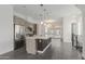 Spacious kitchen featuring stainless appliances, large island, and view into dining area at 1717 E Morten Ave # 7, Phoenix, AZ 85020