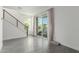 Bright living room featuring sliding glass doors and a modern staircase at 1717 E Morten Ave # 7, Phoenix, AZ 85020