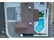 Aerial shot showcasing the home's roof, landscaping, a backyard pool, and outdoor seating areas at 1744 E Luke Ave, Phoenix, AZ 85016