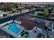 Aerial view highlighting the backyard pool, covered patio, and well-maintained landscaping of this property at 1744 E Luke Ave, Phoenix, AZ 85016