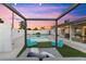 Inviting backyard with a swimming pool, lounge seating, and covered patio at 1744 E Luke Ave, Phoenix, AZ 85016