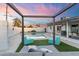 Relaxing backyard with swimming pool, lounge seating, and view of the home at 1744 E Luke Ave, Phoenix, AZ 85016
