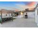 Expansive backyard with a pool, lounge chairs, covered patio with seating, and outdoor grill perfect for entertaining at 1744 E Luke Ave, Phoenix, AZ 85016