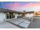 Spacious backyard featuring a paved patio area with stylish outdoor seating, perfect for entertaining at 1744 E Luke Ave, Phoenix, AZ 85016