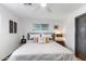 Bright bedroom featuring a queen bed, neutral decor, and a ceiling fan at 1744 E Luke Ave, Phoenix, AZ 85016