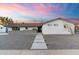 Charming single-story home with a modern walkway, low-maintenance landscaping, and a welcoming facade at 1744 E Luke Ave, Phoenix, AZ 85016