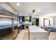 Spacious kitchen and dining area with stainless steel appliances, marble island, and modern lighting at 1744 E Luke Ave, Phoenix, AZ 85016