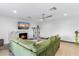Comfortable living room with fireplace, mounted television, and bright aesthetic features at 1744 E Luke Ave, Phoenix, AZ 85016