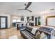 Open-concept living room featuring a modern kitchen, stylish seating, and herringbone wood floors at 1744 E Luke Ave, Phoenix, AZ 85016