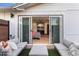 This patio provides an outdoor seating area and a view of the main bedroom at 1744 E Luke Ave, Phoenix, AZ 85016