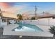 Inviting swimming pool surrounded by a spacious patio and lush landscaping, creating a perfect outdoor oasis at 1744 E Luke Ave, Phoenix, AZ 85016