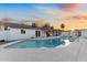 Beautiful pool and outdoor living area including a covered patio, grill, and lush landscaping perfect for relaxing or entertaining at 1744 E Luke Ave, Phoenix, AZ 85016