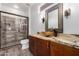 Well-lit bathroom with granite counters, custom vessel sink and a glass enclosed shower at 18140 N Saddle Ridge Dr, Surprise, AZ 85374