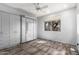 Versatile bedroom featuring a Murphy bed, built-in cabinets, and neutral colors at 18140 N Saddle Ridge Dr, Surprise, AZ 85374
