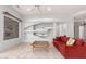 Inviting living room featuring a decorative wall, ceiling fan, and lots of natural light at 18140 N Saddle Ridge Dr, Surprise, AZ 85374