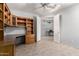 Home office featuring custom built-in shelving, desk, and storage, perfect for remote work or study at 18140 N Saddle Ridge Dr, Surprise, AZ 85374