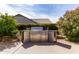 Outdoor stainless steel gas grill with granite countertops surrounded by greenery at 18140 N Saddle Ridge Dr, Surprise, AZ 85374