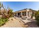 Outdoor patio space includes landscaping with desert foliage and multiple seating areas at 18140 N Saddle Ridge Dr, Surprise, AZ 85374